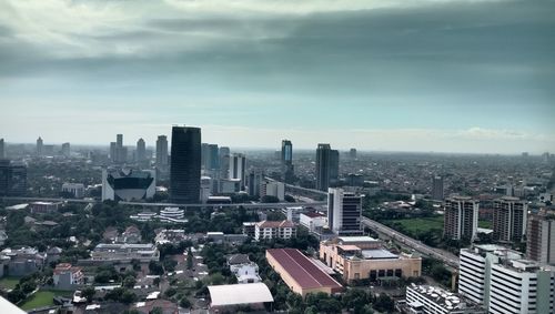 High angle view of buildings in city against sky