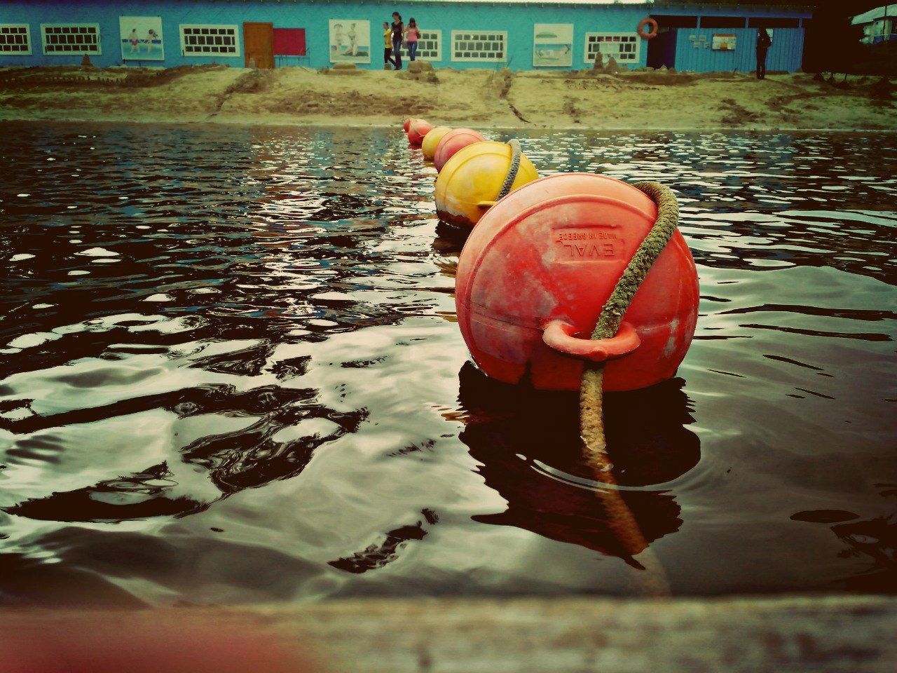 water, red, reflection, buoy, waterfront, outdoors, orange color, protection, river, no people, close-up, safety, tradition, day, transportation, focus on foreground, rippled, nautical vessel, hanging, lake