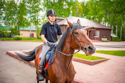 Portrait of woman riding horse