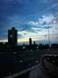 View of buildings against cloudy sky