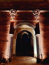 Illuminated entrance of historic building