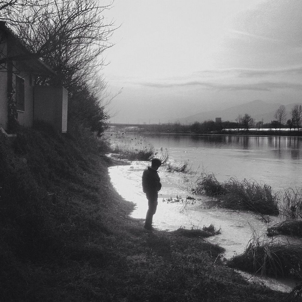 water, lifestyles, rear view, leisure activity, standing, full length, sky, lake, tranquility, reflection, tranquil scene, nature, men, person, walking, scenics, beauty in nature, lakeshore