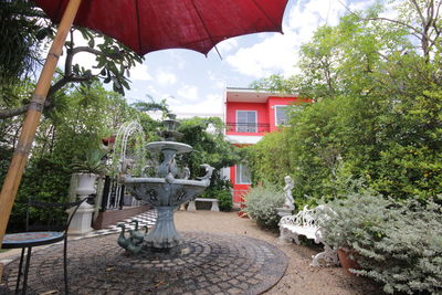 Empty chairs and tables in garden