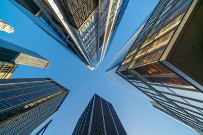 Low angle view of modern buildings against clear sky