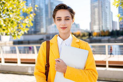 Portrait of young man using mobile phone