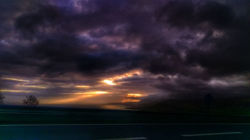 Scenic view of landscape against cloudy sky