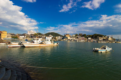 Scenic view of sea and buildings against sky