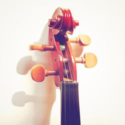 Close-up of guitar against white background