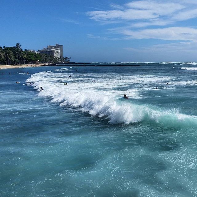 sea, water, wave, surf, beach, sky, shore, blue, horizon over water, waterfront, building exterior, motion, scenics, beauty in nature, built structure, architecture, nature, coastline, splashing, tranquil scene