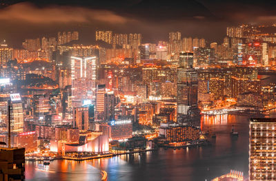 Aerial view of illuminated buildings in city at night