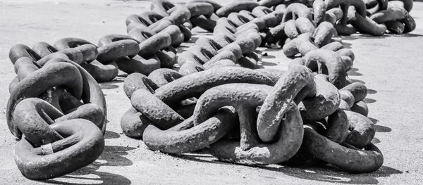 Close-up of chain on footpath