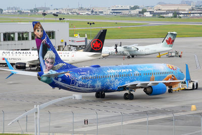 View of airplane at airport runway