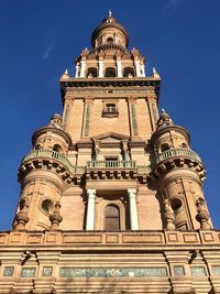 Low angle view of historical building against blue sky