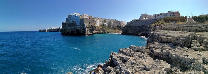 Scenic view of sea against clear blue sky