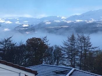 Scenic view of mountains against sky during winter