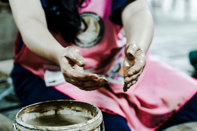 Midsection of woman with messy hands