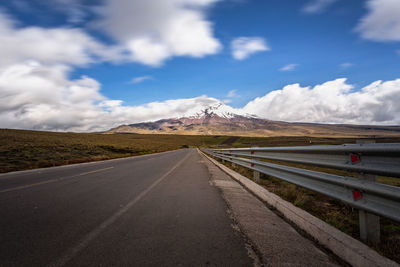 Road by landscape against sky