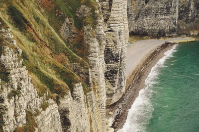 Scenic view of cliffs by the sea