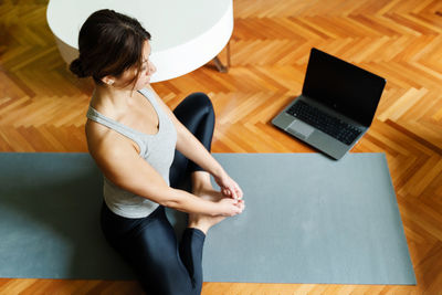 High angle view of woman using mobile phone