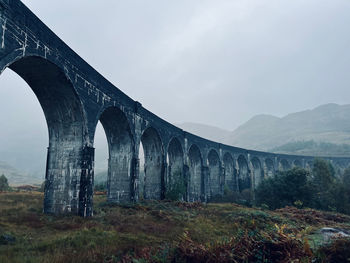 Viaduct against mountains