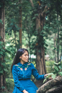 Woman sitting in a forest