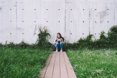 Full length of woman standing on grass