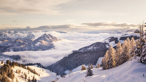 Scenic view of snow covered mountains against sky