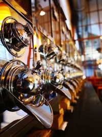 Close-up of electric lamp in row