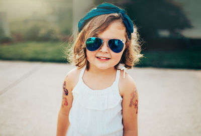 Portrait of cute girl wearing sunglasses