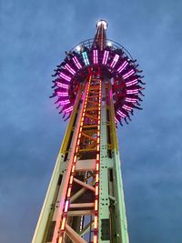 Low angle view of ferris wheel against sky