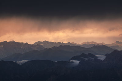 Scenic view of mountains against sky during sunset