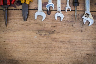 Low section of men on wooden table