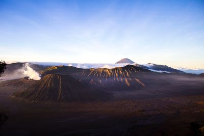 View of volcanic landscape against sky