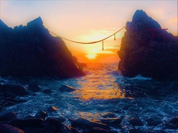 Scenic view of sea against sky during sunset