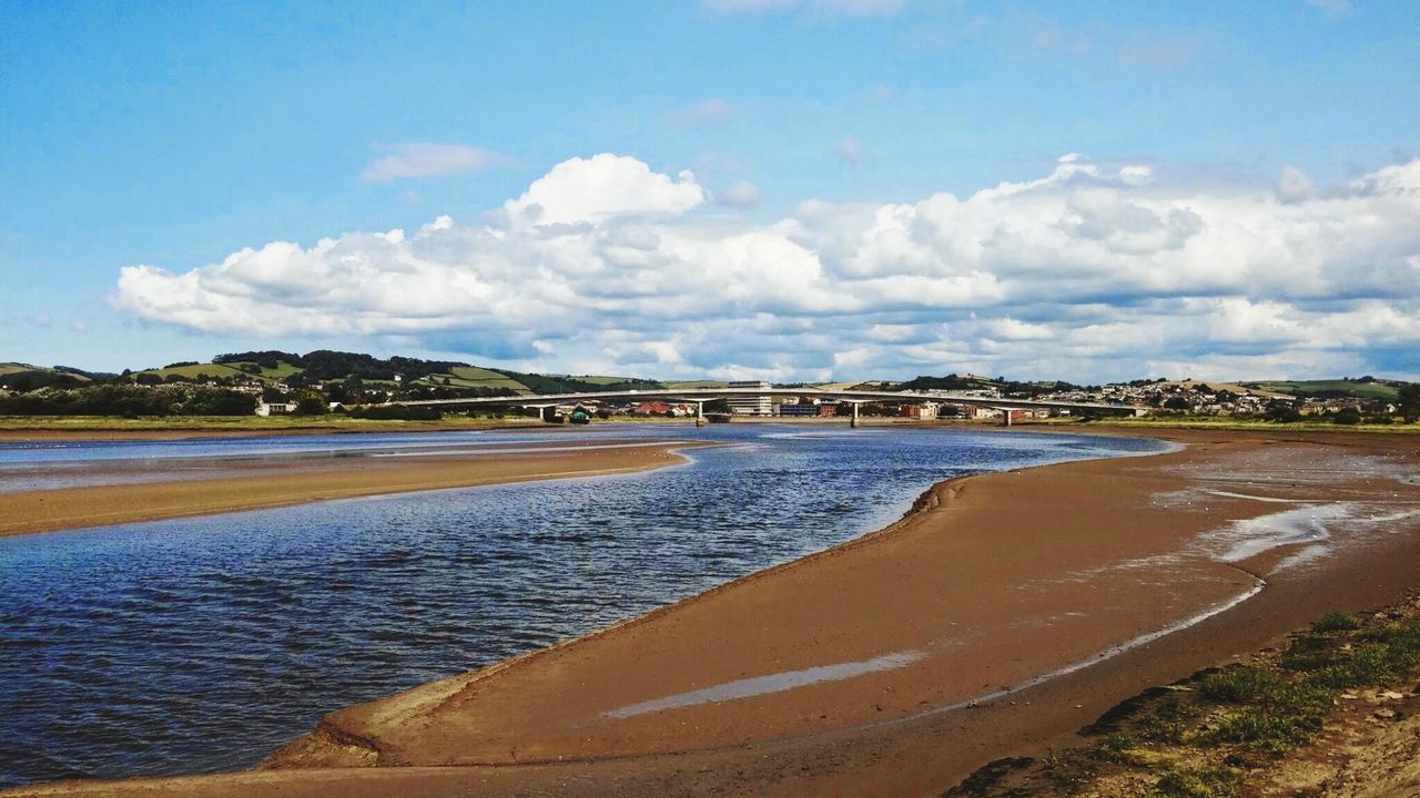 PANORAMIC VIEW OF BEACH AGAINST SKY