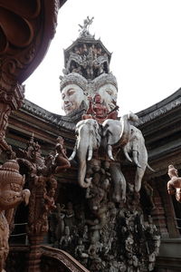 Low angle view of statue against building