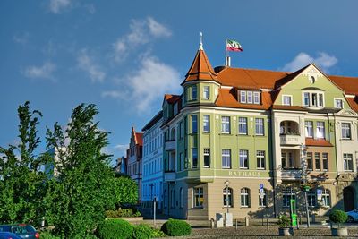 Buildings in city against sky