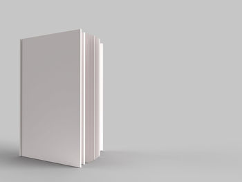 Low angle view of empty paper against white background