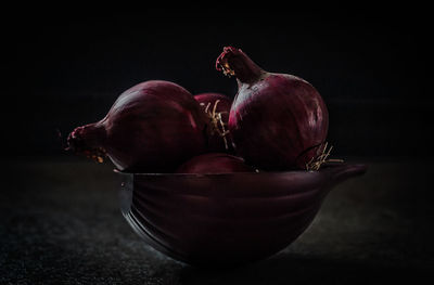 Close-up of red cherries in bowl