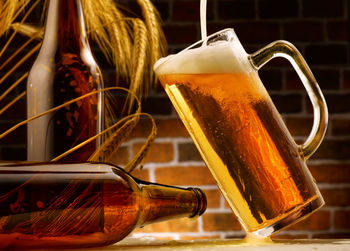 Close-up of beer glass on table