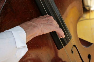Midsection of man playing piano