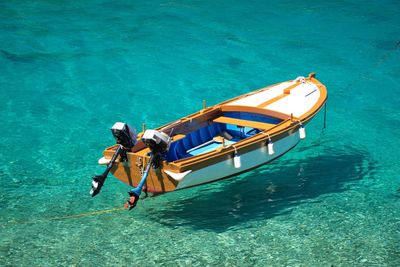 High angle view of wooden boat on turquoise clear sea