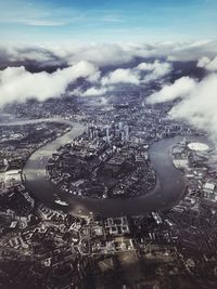 High angle view of city against cloudy sky