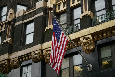 Low angle view of american flag on building