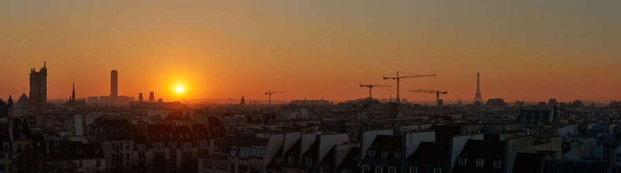 View of buildings in city during sunset