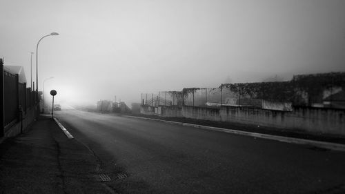 Empty road against sky