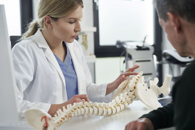 Doctor discussing with patient at clinic