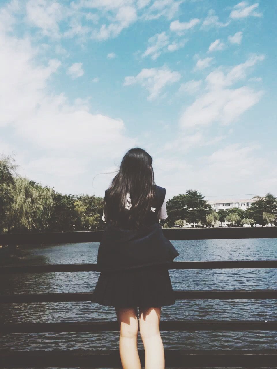 standing, lifestyles, tree, water, sky, leisure activity, person, lake, personal perspective, low section, day, outdoors, cloud - sky, nature, rear view, three quarter length, young adult