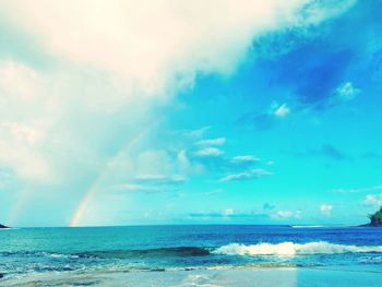 Scenic view of sea against blue sky