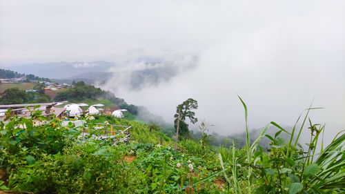 Scenic view of waterfall against sky